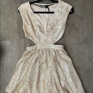 Glittery gold dress with cut outs
